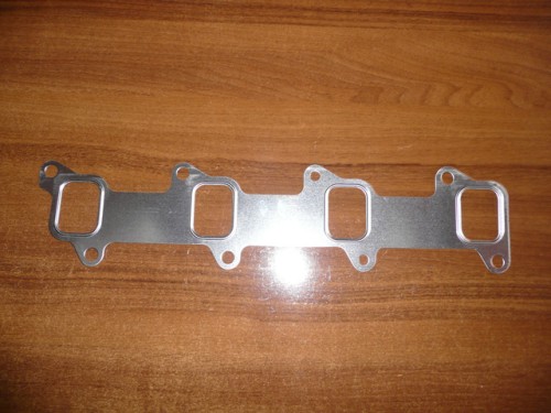 Uszczelka pod kolektor wydechowy Ford New Holland 83983680 E8NN9448BA